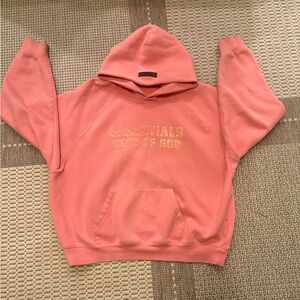 Fear of God Essentials Hoodie in Coral